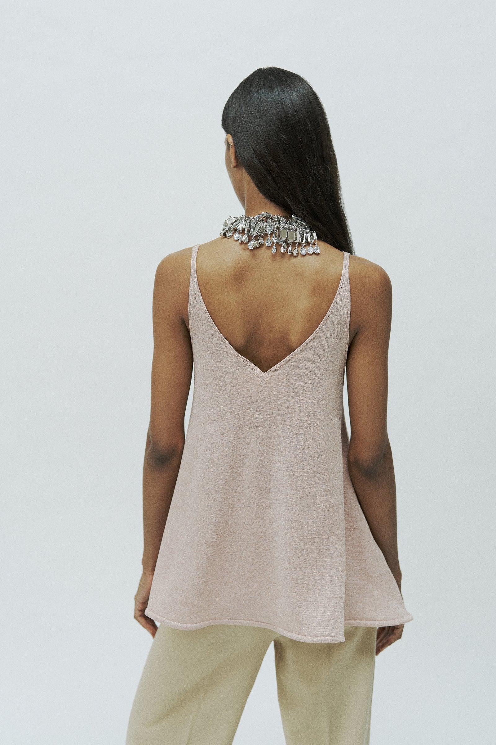 TANK TOP WITH FLARED DETAIL